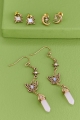 Rose Quartz Golden Butterfly Earring Set laid out