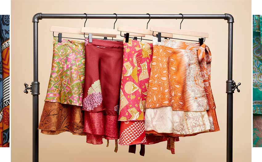 Assortment of short, warm-color sari skirts are featured.